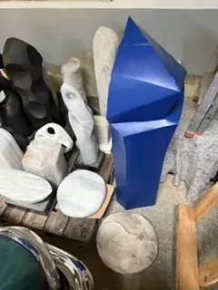 Sculptures of white and black marble, stored close together