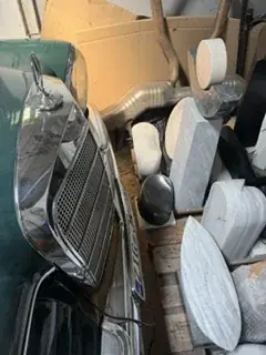 White and black stone sculptures in storage