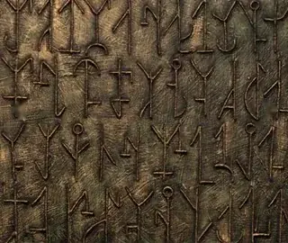 Relief with sign-like forms in bronze