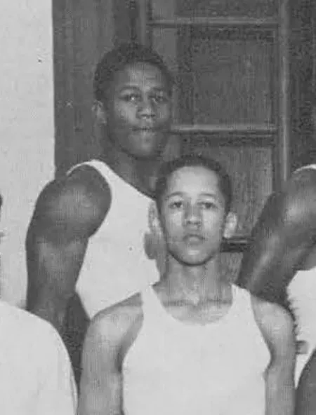 Detail from the 1949 Sumner High School yearbook: young gymnasts in undershirts; back row, left, according to the caption, Ronald Johnson